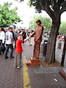 A Copper Man Shakes Mark's Hand